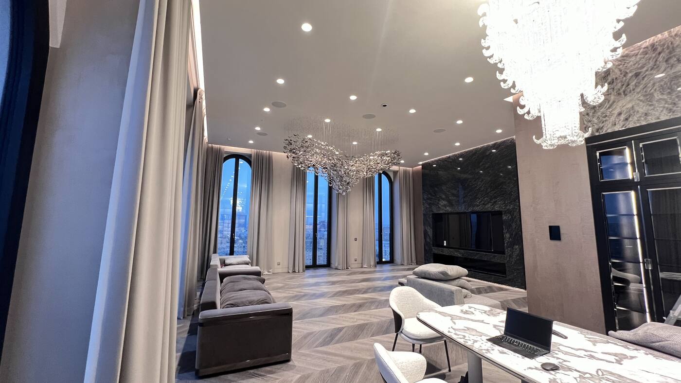 Living and dining room with tall windows