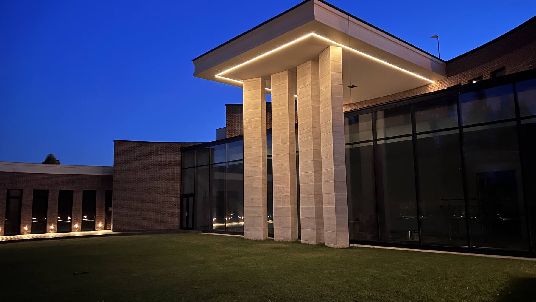 Private villa at dusk with architectural lighting